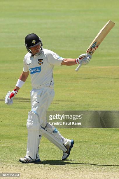 Marcus North of the Warriors celebrates his half century during day two of the Sheffield Shield match between the Western Australia Warriors and the...