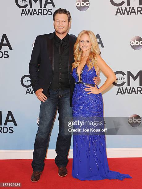 Singers Blake Shelton and wife Miranda Lambert attend the 47th annual CMA Awards at the Bridgestone Arena on November 6, 2013 in Nashville, Tennessee.