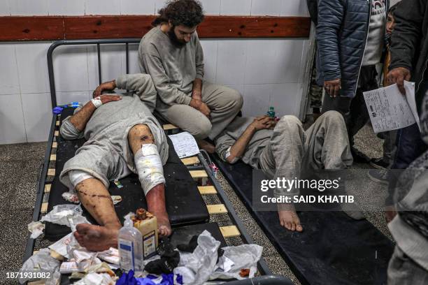 Graphic content / Injured men who were among Palestinians detained by the Israeli military during their operation in the northern Gaza Strip and...