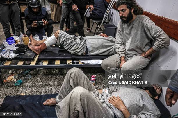 Graphic content / Injured men who were among Palestinians detained by the Israeli military during their operation in the northern Gaza Strip and...