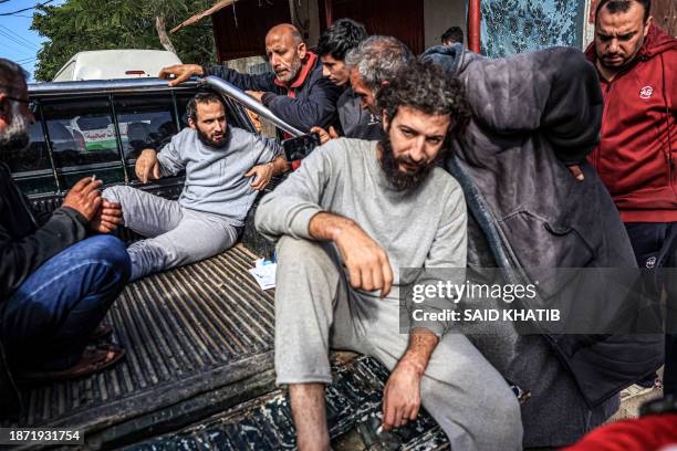 Injured men who were among Palestinians detained by the Israeli military during their operation in the northern Gaza Strip and recently released...