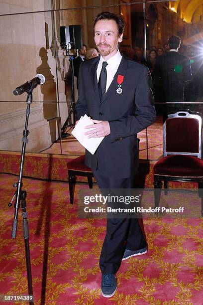 Star Dancer Nicolas le Riche receives the Insignia of Officer of the Legion of Honour from Pierre Berge, at Opera Garnier on November 6, 2013 in...