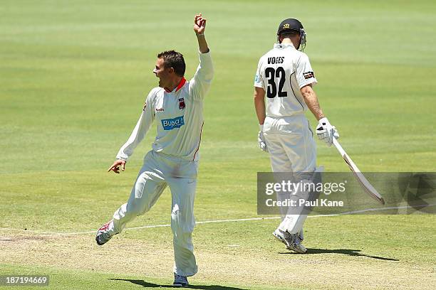 Johan Botha of the Redbacks celebrates the wicket of Will Bosisto of the Warriors during day two of the Sheffield Shield match between the Western...