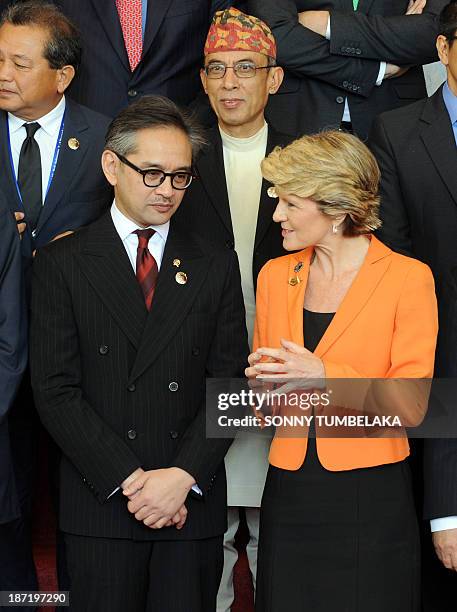 Indonesia's Foreign Minister Marty Natalegawa chats to Australia's Foreign Minister Julie Bishop after the opening of the Bali Democracy Forum in...