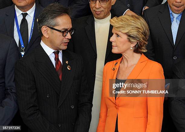 Indonesia's Foreign Minister Marty Natalegawa chats to Australia's Foreign Minister Julie Bishop after the opening of the Bali Democracy Forum in...