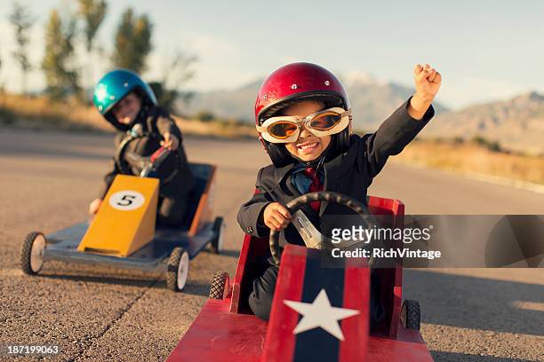 young business jungen spielzeug-autos rennen - winning stock-fotos und bilder