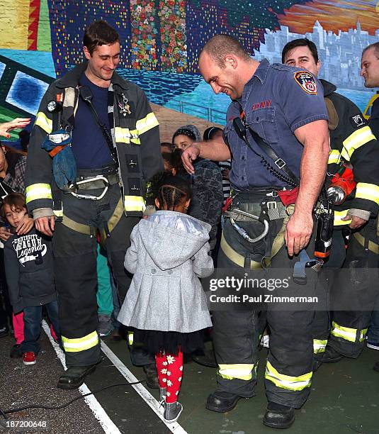 Members of the NYC FDNY attend the CityArts & Disney "Celebrating The Heros Of Our City" Mural Ribbon Cutting at Henry M. Jackson Playground on...