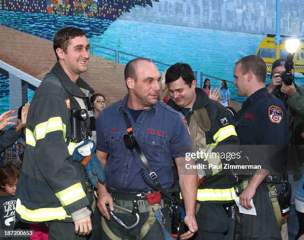 Members of the NYC FDNY attend the CityArts & Disney "Celebrating The Heros Of Our City" Mural Ribbon Cutting at Henry M. Jackson Playground on...