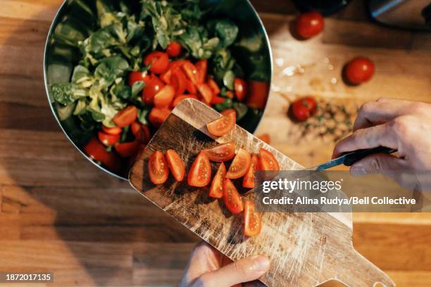 tomato salad preparation - salad bowl stock pictures, royalty-free photos & images