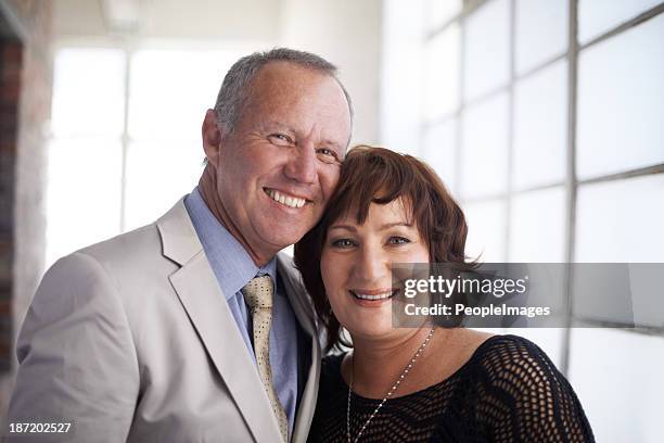 inspecting new office space for their company - business mature couple portrait bildbanksfoton och bilder