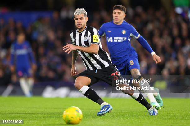 Enzo Fernandez of Chelsea in action with Bruno Guimaraes of Newcastle United during the Carabao Cup Quarter Final match between Chelsea and Newcastle...