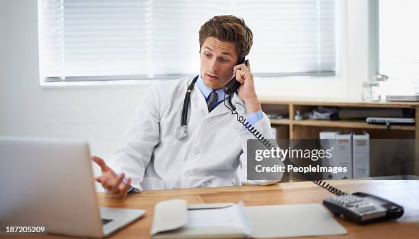 discussing a patient's status - peopleimages hospital stock pictures, royalty-free photos & images