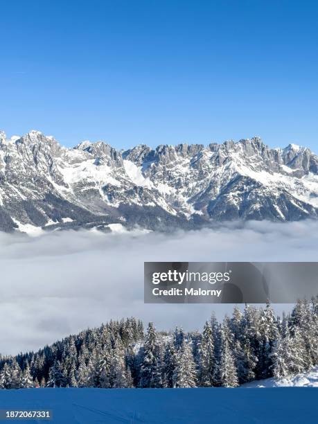 panoramic view on snow capped mountain in the ski area wilder kaiser, austria - kaiser stock pictures, royalty-free photos & images