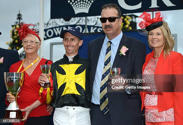 Nash Rawiller who rode Kirramosa and trainer John Sargent pose with the trophy after winning race 6 the Crown Oaks during Oaks Day at Flemington...