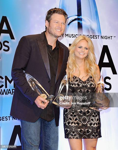 Singers Blake Shelton and wife Miranda Lambert pose in the press room at the 47th annual CMA Awards at the Bridgestone Arena on November 6, 2013 in...