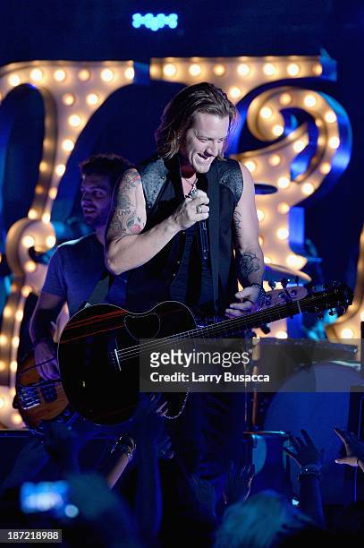 Tyler Hubbard of Florida Georgia Line performs onstage during the 47th annual CMA awards at the Bridgestone Arena on November 6, 2013 in Nashville,...