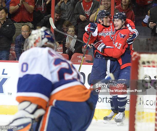 Washington Capitals right wing Tom Wilson celebrates his first NHL goal with Alex Ovechkin who made the assist on the play during third period action...