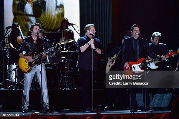 Jay DeMarcus, Gary LeVox and Joe Don Rooney of Rascal Flatts performs onstage during the 47th annual CMA awards at the Bridgestone Arena on November...