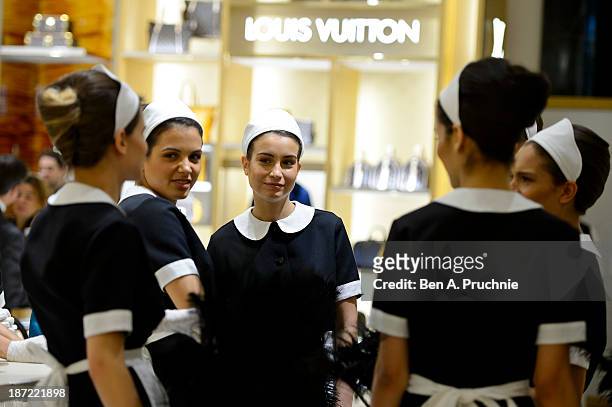 Models pose during a photocall to launch the Louis Vuitton Townhouse at Selfridges on November 7, 2013 in London, England. The first Louis Vuitton...