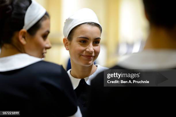 Models pose during a photocall to launch the Louis Vuitton Townhouse at Selfridges on November 7, 2013 in London, England. The first Louis Vuitton...