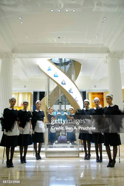 Models pose during a photocall to launch the Louis Vuitton Townhouse at Selfridges on November 7, 2013 in London, England. The first Louis Vuitton...