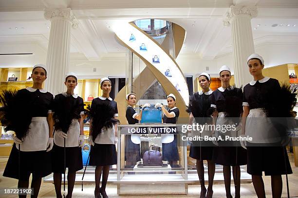 Models pose during a photocall to launch the Louis Vuitton Townhouse at Selfridges on November 7, 2013 in London, England. The first Louis Vuitton...