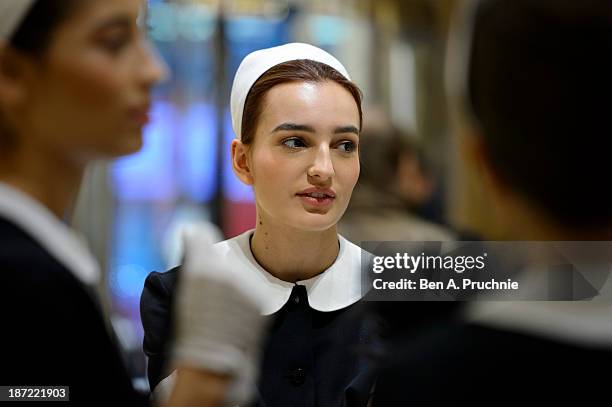 Models pose during a photocall to launch the Louis Vuitton Townhouse at Selfridges on November 7, 2013 in London, England. The first Louis Vuitton...