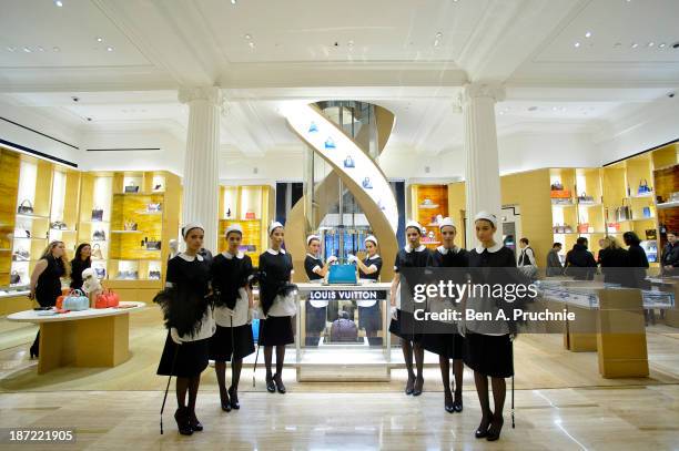 Models pose during a photocall to launch the Louis Vuitton Townhouse at Selfridges on November 7, 2013 in London, England. The first Louis Vuitton...