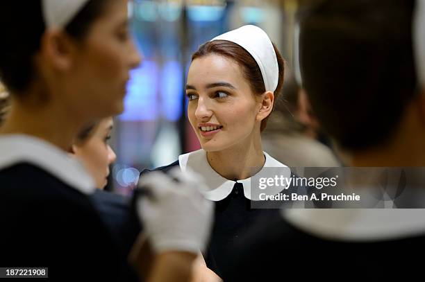 Models pose during a photocall to launch the Louis Vuitton Townhouse at Selfridges on November 7, 2013 in London, England. The first Louis Vuitton...