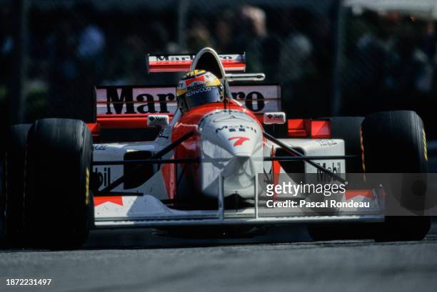 Mark Blundell from Great Britain drives the Marlboro McLaren Mercedes McLaren MP4/10B Mercedes V10 out of Casino Square during the Formula One Grand...