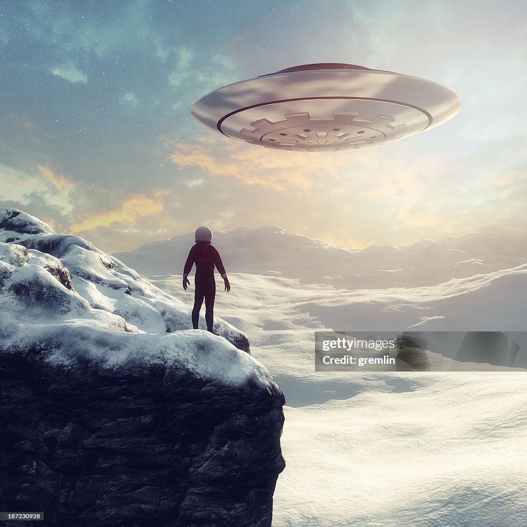 Astronaut on distant planet discovering UFO