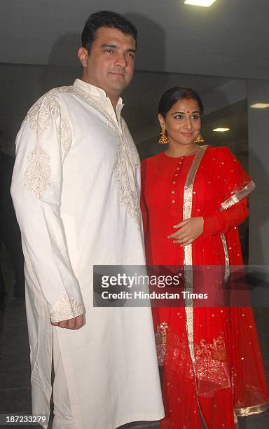 Bollywood actor Vidya Balan with her husband Siddharth Roy Kapur during Diwali party at Aamir Khan's residence on November 3, 2013 in Mumbai, India.