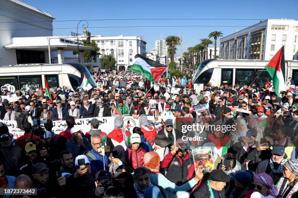 Moroccans wave Palestinian flags during a protest in Rabat on December 24, 2023 in solidarity with Gaza amid the ongoing conflict between Israel and...