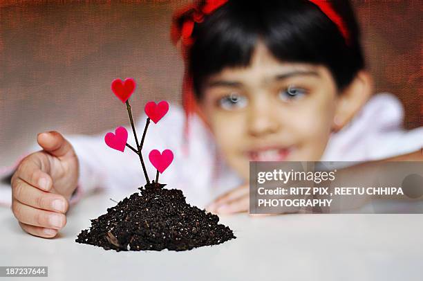 don't plant anything but love - fake of indian girls stock pictures, royalty-free photos & images