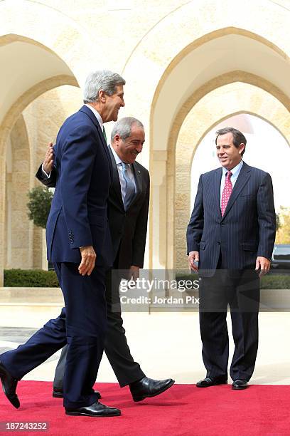 Secretary of State John Kerry is received by his Jordanian counterpart Nasser Judeh upon his arrival at the royal palace November 7, 2013 in Amman,...