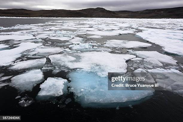 floating iceberg in bellot strait - bellot strait stock pictures, royalty-free photos & images