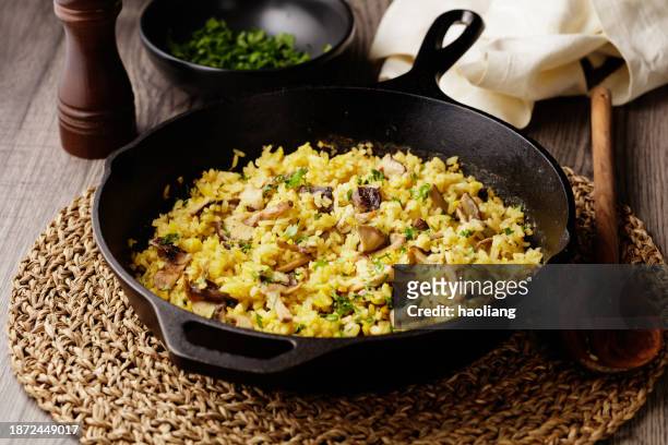 one pan baked shiitake mushroom rice for vegan diet - pilau rice stock pictures, royalty-free photos & images