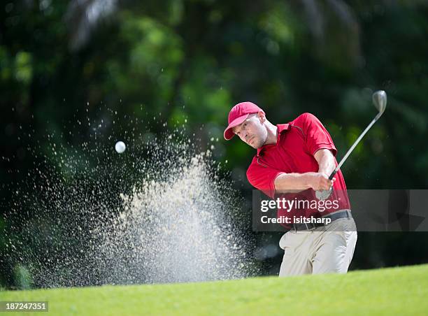 golfer playing shot - golf bunker low angle stock pictures, royalty-free photos & images