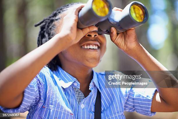 he loves bird watching! - child with binoculas stockfoto's en -beelden