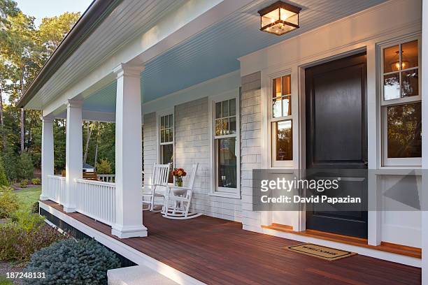 front porch of new custom home with sun light. - alpendre imagens e fotografias de stock