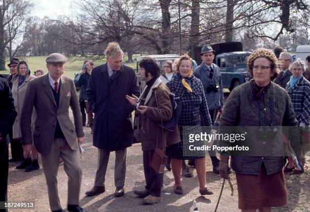 Ray Bellisario, one of the first photographers to take unofficial and informal photographs of the Royal Family, being 'moved on' by Chief Inspector...