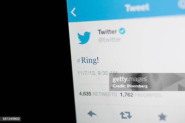 Twitter Inc. Tweet regarding the company ringing the opening bell on the New York Stock Exchange is displayed on an Apple Inc. IPhone arranged for a...