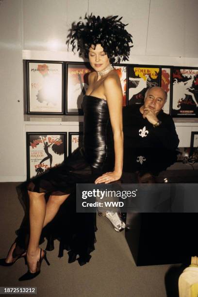 Bloomingdale's executive Kal Ruttenstein with a model wearing an outfit from the department store's Moulin Rouge promotion, circa 2001