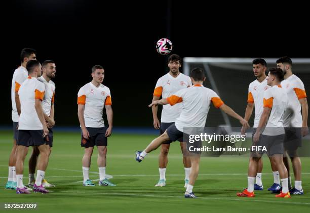 Ruben Dias of Manchester City and his team mates warm up during a Manchester City training session ahead of the FIFA Club World Cup Saudi Arabia 2023...