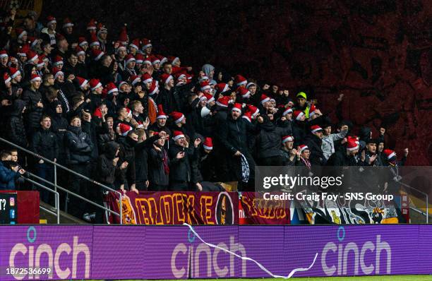 Motherwell fans wear Santa hats during a cinch Premiership match between Motherwell and Rangers at Fir Park, on December 23 in Motherwell, Scotland.