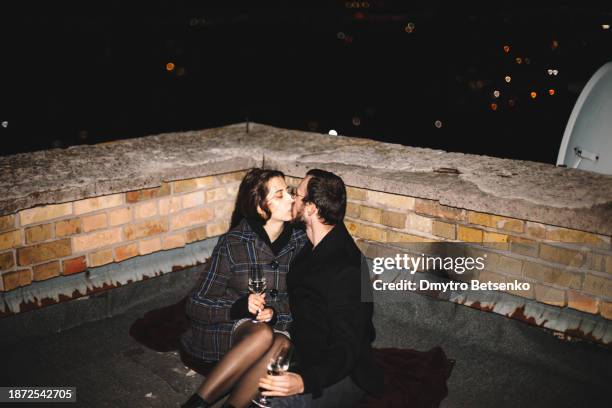 young-couple-kissing-while-