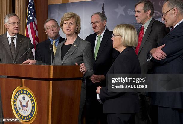 Democratic Senator Tammy Baldwin of Wisconsin , the first openly gay member of the Senate, speaks during a press conference as the Senate prepares to...