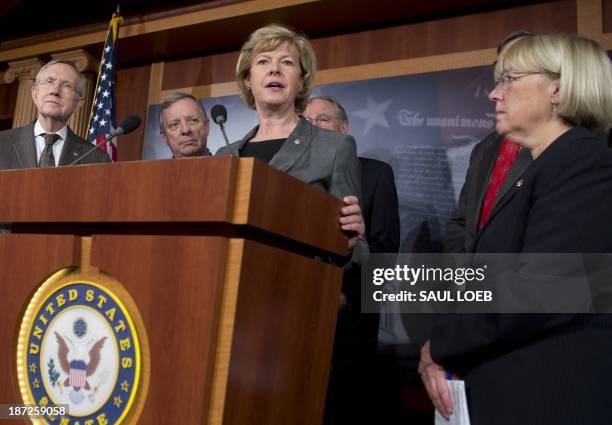 Democratic Senator Tammy Baldwin of Wisconsin , the first openly gay member of the Senate, speaks during a press conference as the Senate prepares to...