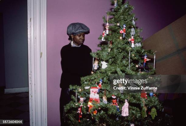 American actress and comedian Whoopi Goldberg with her Christmas tree at the 2nd Annual 'A Night of 100 Trees' Gala, held at The Limelight in the...