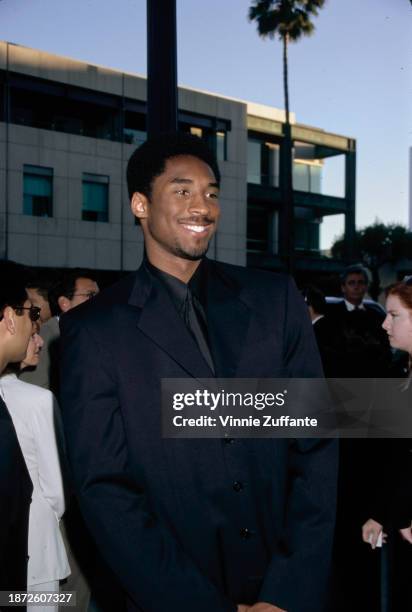 American basketball player Kobe Bryant attends the Beverly Hills premiere of 'The Mask of Zorro', held at the Academy Theater in Beverly Hills,...